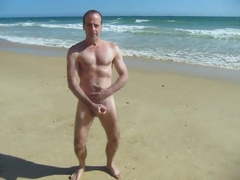 WANKING AND SHOWING OFF HARD COCK AT NUDIST BEACH