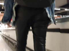 Nice teen in leather pants at the supermarket
