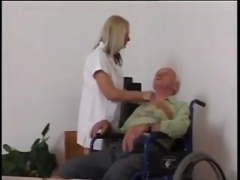 Young nurse takes care of grandpa